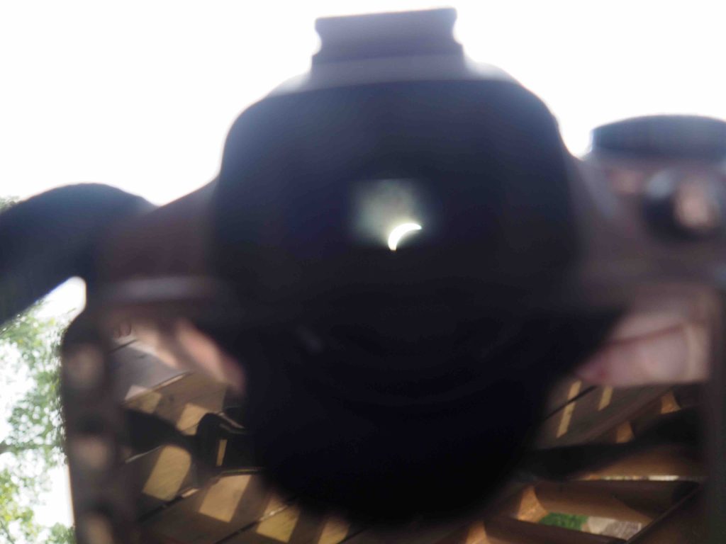 Camera shot of an eclipse through a telescope