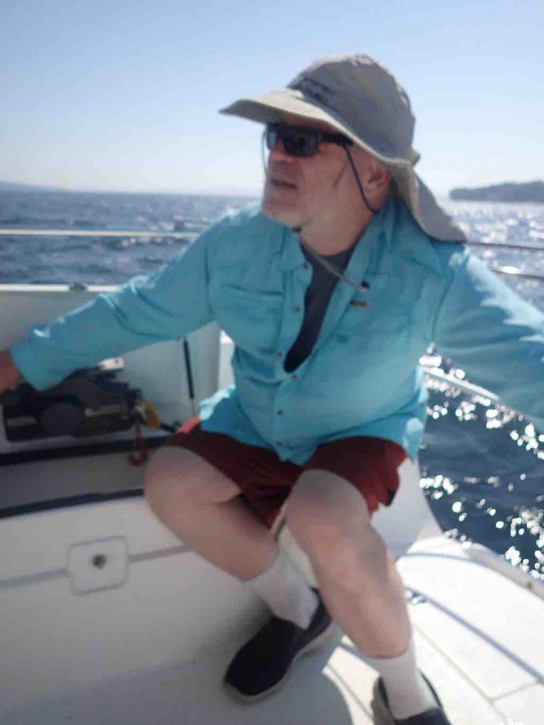 At the tiller of a trimaran