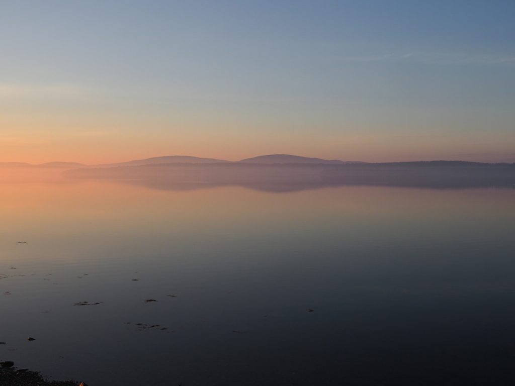 Reflections of mountains on the Western Bay 5:30 am