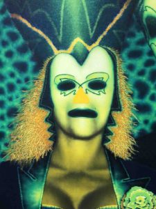 Woman with day-glo green mask