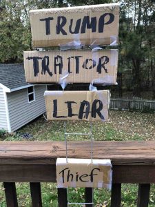 Sign saying, TRUMP, TRAITOR, LIAR, THIEF