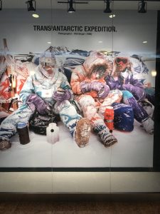 Four guys freezing in front of their tent in Antarctica