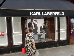 Woman looking in shop window.