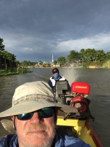 Author's alter ego on a boat ride somewhere in Indonesia