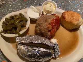 Plate of Meatloaf, Baked Potato and Greenbeans